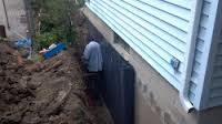 Foundation waterproofing next to vinyl siding