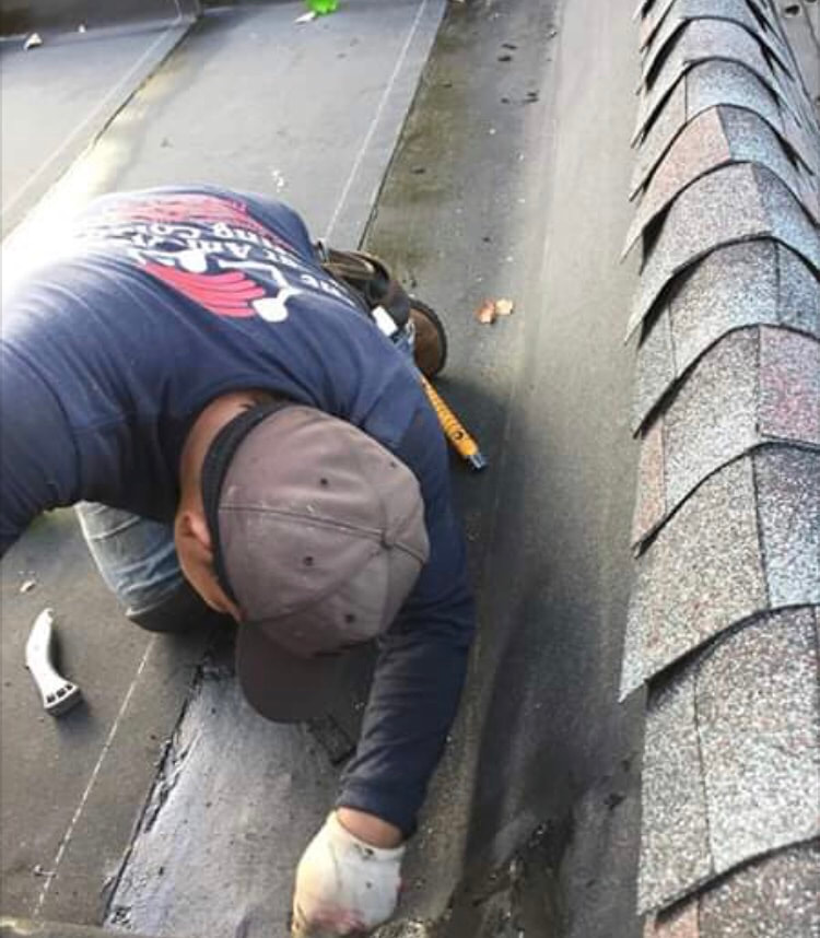 Gino's roofer working on a roof